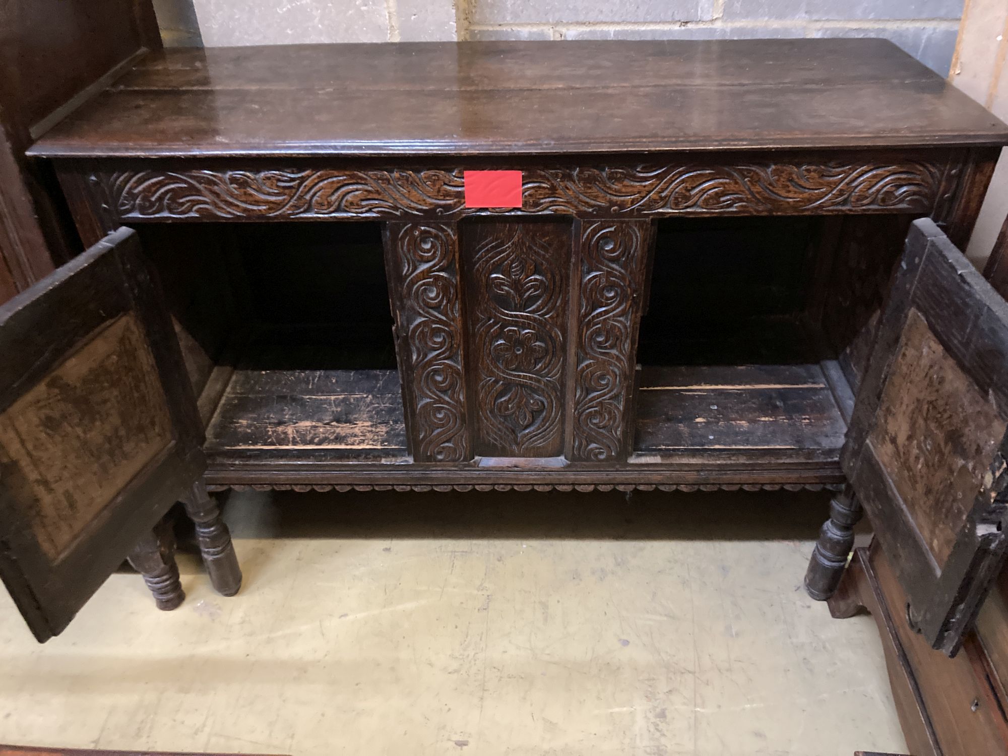 A 17th century and later oak two door cabinet, width 126cm, depth 46cm, height 94cm